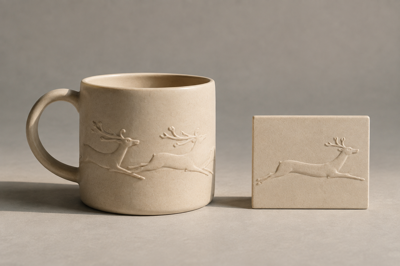 AI concept of an ivory ceramic cup with elongated reindeer in shallow relief beside a matching animal relief tile.